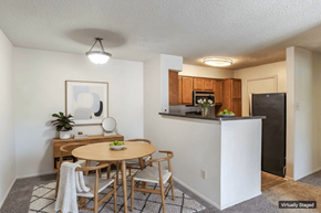 Laurel apartment for rent - A kitchen with a table and chairs in the middle of the room.