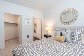 Eugene apartment for rent - A bedroom with a large bed and a walk-in closet.