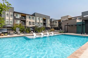 Denver apartment for rent - our apartments have a large swimming pool with lounge chairs