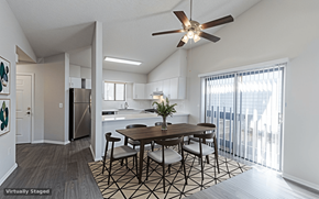 Westminster townhouse for rent - A dining room with a table and chairs and a ceiling fan.