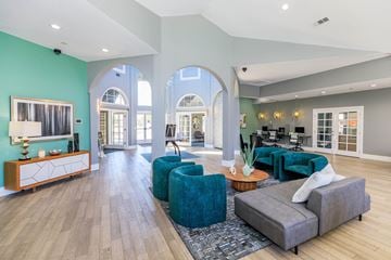 Lakewood apartment for rent - A living room with a grey sofa and a wooden sideboard.
