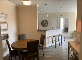 Gallatin apartment for rent - A dining room with a wooden table and chairs.