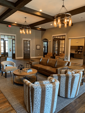 Gallatin apartment for rent - Clubhouse  with a brown couch, a coffee table, and a chandelier.
