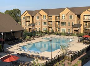 Gallatin apartment for rent - A large apartment complex with a pool and patio area.