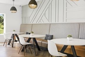Overland Park apartment for rent - A seating area with modern chairs and tables.
