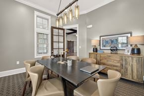 Gallatin apartment for rent - A dining room with a black table and chairs.