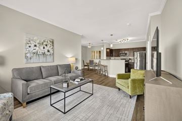 Gallatin apartment for rent - A living room with a grey couch, a coffee table, and a painting on the wall.