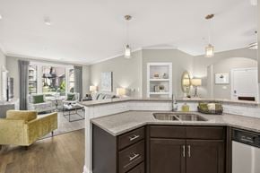 Gallatin apartment for rent - A modern kitchen with a yellow chair and a large window.