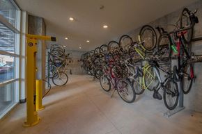Vancouver apartment for rent - A yellow bike rack with many bikes on it.