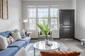 Phoenix apartment for rent - a living room with a blue couch and a coffee table