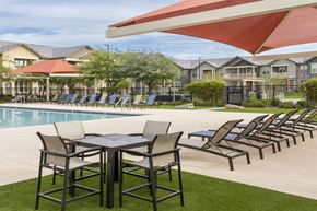 Phoenix apartment for rent - our apartments have a pool and a patio with chairs and tables