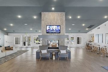 Henderson apartment for rent - A modern living room with a television mounted on the wall.