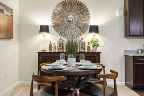 Dumfries apartment for rent - A dining room with a round table set for two.