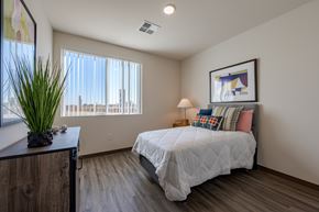 Maricopa apartment for rent - A bedroom with a large bed and a view of the city.