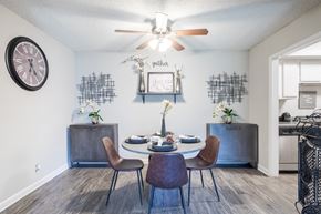 Nashville apartment for rent - a dining room with a table and chairs and a ceiling fan