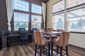 Colorado Springs apartment for rent - a dining room with a table and chairs and large windows