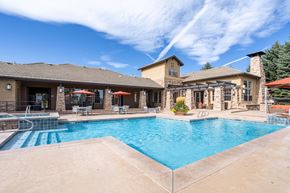 Colorado Springs apartment for rent - a swimming pool with a house in the background