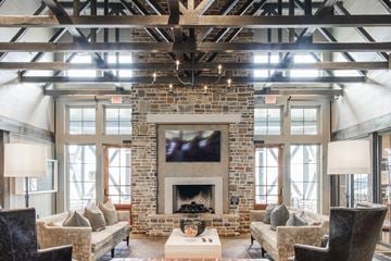Nashville apartment for rent - a living room with a fireplace and a tv on the wall