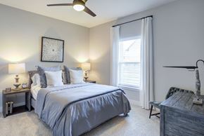 Nashville apartment for rent - a bedroom with a bed and a ceiling fan