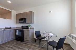 Aurora apartment for rent - A kitchen with a table and chairs.