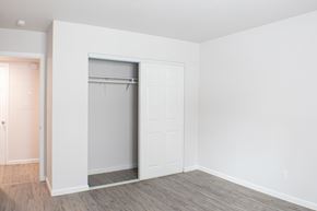 Sparks apartment for rent - A white closet with a door open.