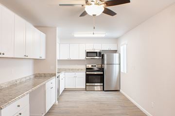 Sparks apartment for rent - A kitchen with a fan hanging from the ceiling.