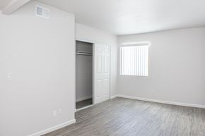 Sparks apartment for rent - A bedroom with a closet and a window.