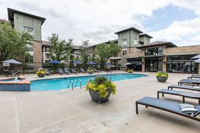 Broomfield apartment for rent - A pool area with a bench and a planter.