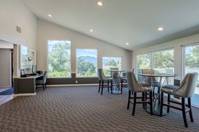 Colorado Springs apartment for rent - a dining room with a table and chairs and large windows