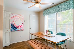 Columbia apartment for rent - a dining room with a table and chairs and a ceiling fan
