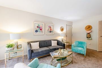 Columbia apartment for rent - a living room with a couch and a glass coffee table