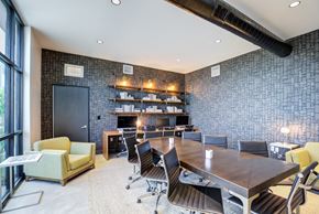 Ft Collins apartment for rent - A conference room with a long table surrounded by chairs.