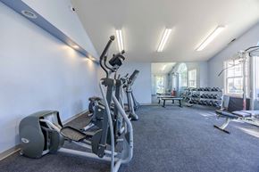 Durham apartment for rent - A gym with a treadmill, weights, and exercise equipment.