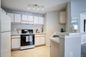 Marlboro apartment for rent - a kitchen with white cabinets and a stove and a refrigerator