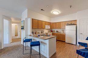 Littleton apartment for rent - a kitchen with a counter top and a refrigerator