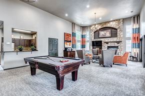 Broomfield apartment for rent - play a game of pool in our clubhouse at our apartments