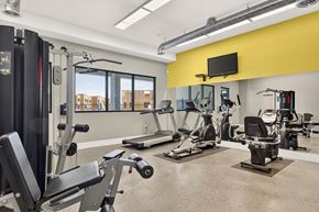 Albuquerque apartment for rent - A gym with a variety of equipment including treadmills, weights, and exercise machines.