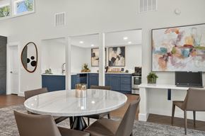 Colorado Springs apartment for rent - A modern dining room with a round table and chairs.