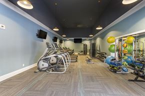 Newport News apartment for rent - A gym with a variety of exercise equipment.