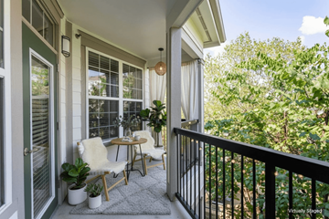 Hendersonville apartment for rent - A balcony with a table and chairs.