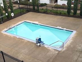 Vancouver apartment for rent - A person sitting on a chair by a pool.