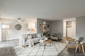 Beaverton apartment for rent - A living room with a grey couch, a coffee table, and a rug.