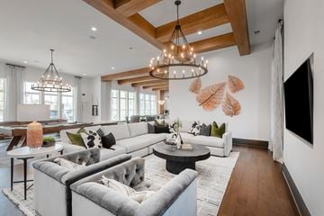 Gallatin apartment for rent - A modern living room with a grey sofa set and a wooden ceiling.