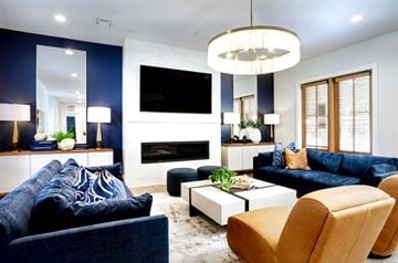 Columbia apartment for rent - A modern living room with a blue couch and a white coffee table.