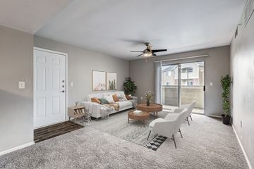 Broomfield apartment for rent - A living room with a grey carpet and a white sofa.