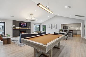 Gallatin apartment for rent - A pool table is in the middle of a living room.