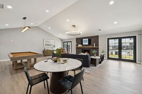 Gallatin apartment for rent - A modern dining room with a pool table and a fireplace.