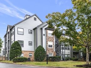 Franklin apartment for rent - A modern apartment building with a mix of grey and stone facades.