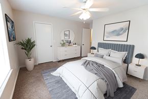 Gallatin apartment for rent - a white bedroom with a bed and a white dresser