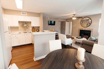 Pearl apartment for rent - A modern kitchen with a dining table and chairs.